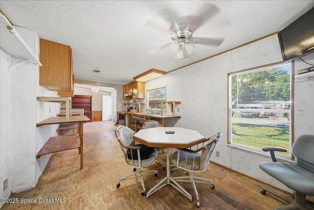 a view of a dining room with furniture window and outside view