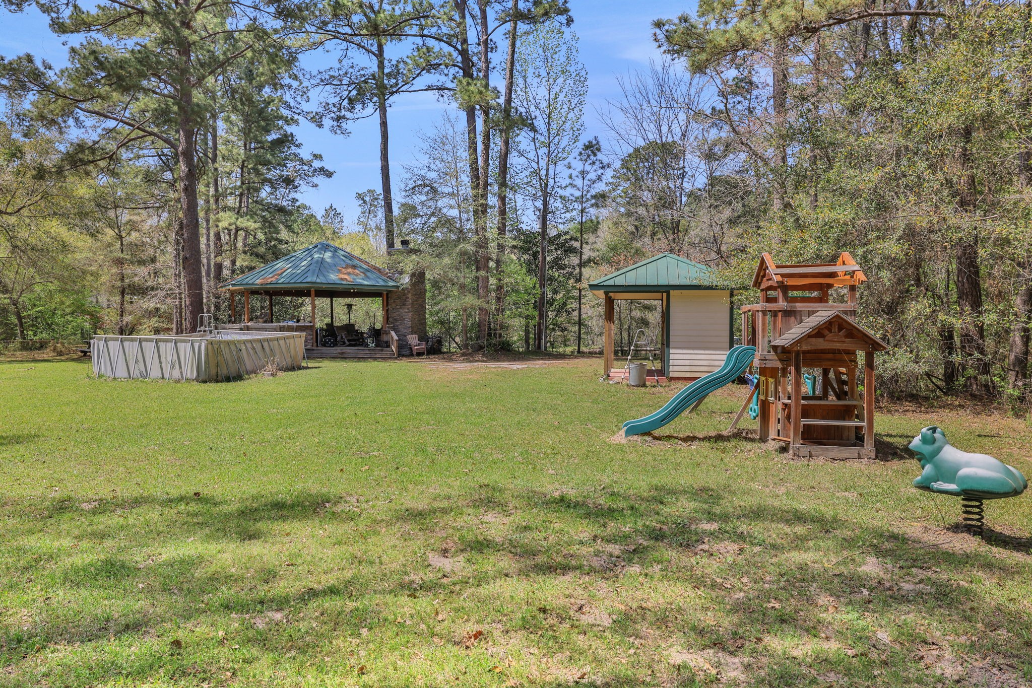 250 Critter Creek Road Coldspring, TX 77331 - Photo 22 of 48 Grounds near the pavilion has so much potential for outdoor entertaining!