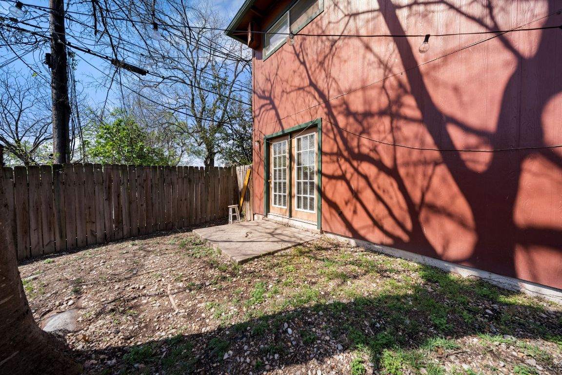 2314 Parker Lane, Unit 5 Austin, TX 78741 - Photo 16 of 17 a view of a backyard with wooden fence