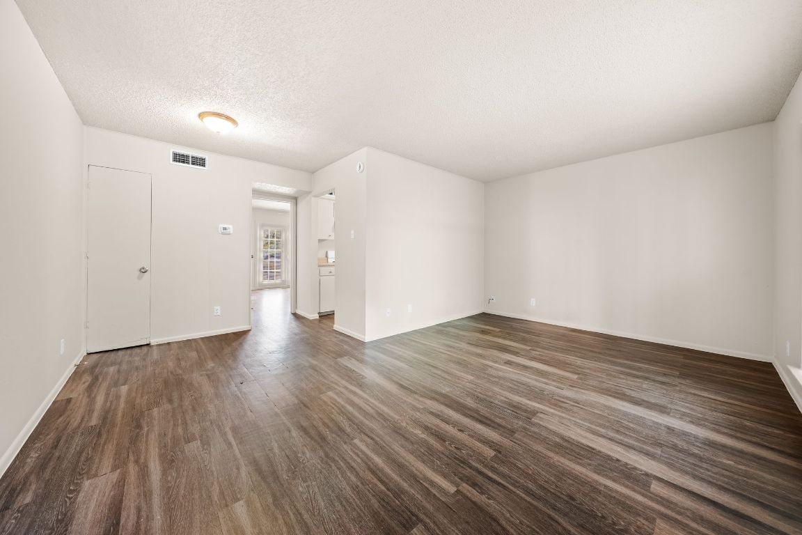 2314 Parker Lane, Unit 5 Austin, TX 78741 - Photo 2 of 17 a view of empty room with wooden floor