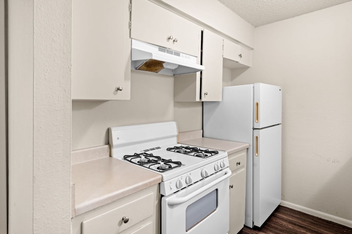 2314 Parker Lane, Unit 5 Austin, TX 78741 - Photo 7 of 17 a white refrigerator freezer and a stove