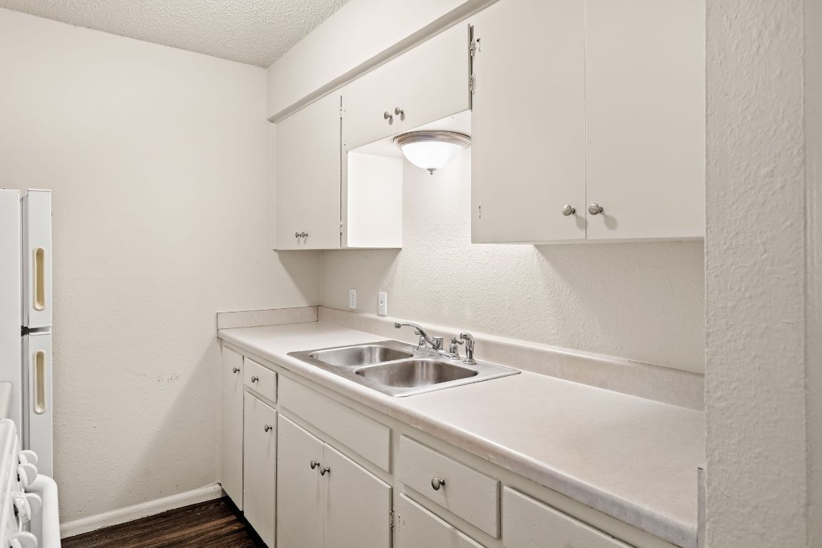 2314 Parker Lane, Unit 5 Austin, TX 78741 - Photo 8 of 17 a kitchen with a sink and cabinets