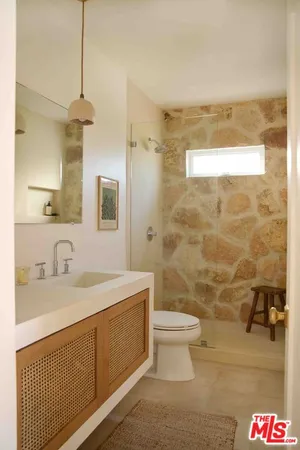 a bathroom with a bathtub and window