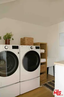 a view of house with yard and sitting area
