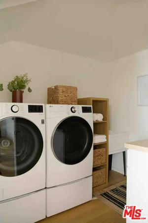 a view of house with yard and sitting area