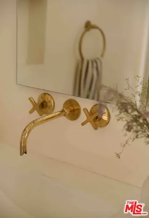 a view of a house with swimming pool and sitting area