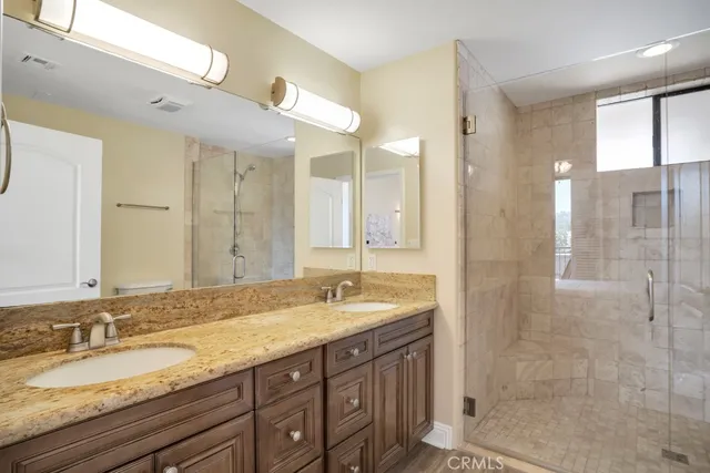 a spacious bedroom with a large bed and a tv