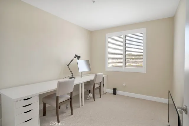 a kitchen with granite countertop a refrigerator stove and microwave