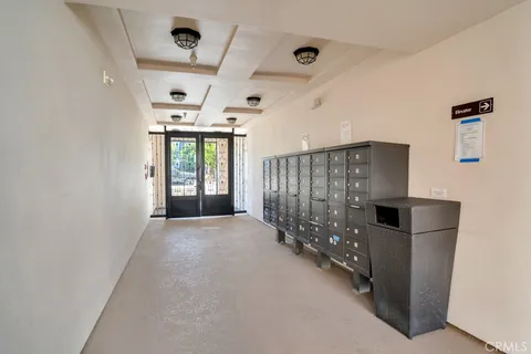 a view of a hallway with seating area