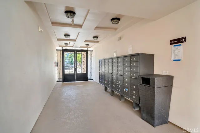 a view of a hallway with seating area