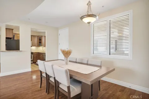 a view of a dining room with a table and chairs