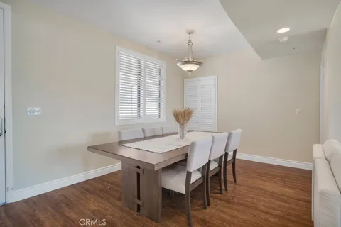 a large kitchen with a table and chairs