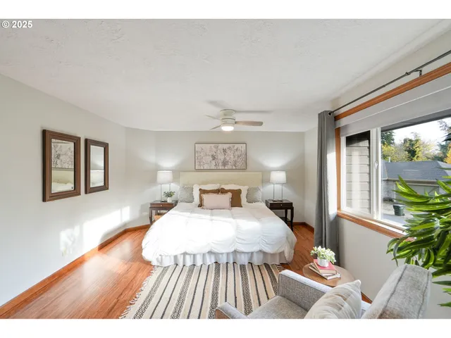 a bedroom with a bed and a potted plant