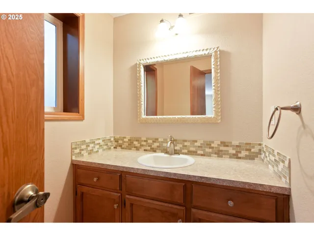 a bathroom with a sink and a mirror