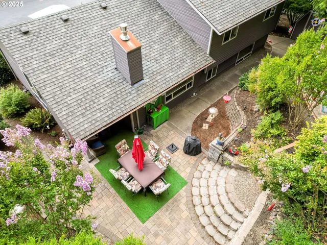 an aerial view of a house with a patio