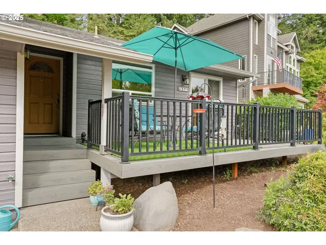 a view of a chair and table in the balcony