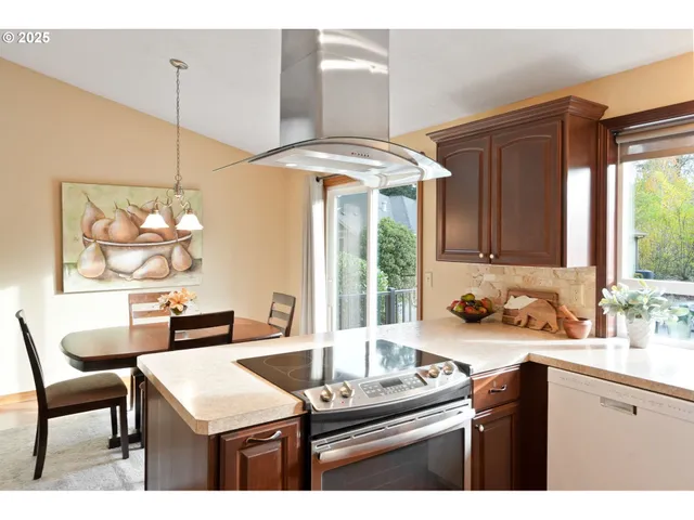 a kitchen with a table chairs and a stove