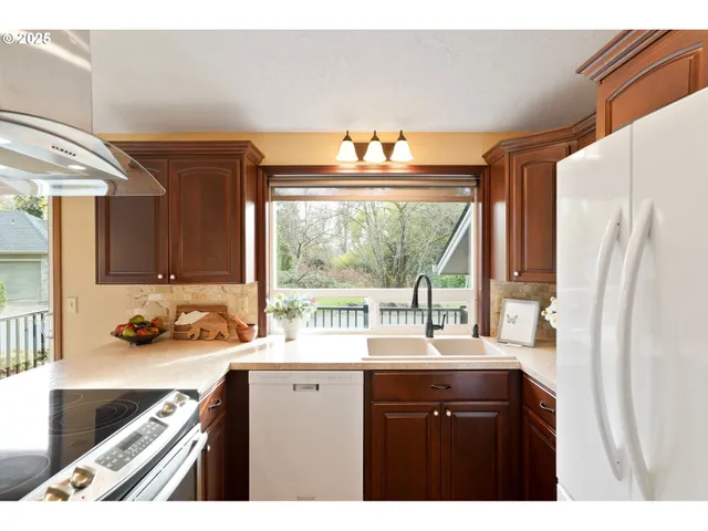 a bathroom with a sink a large mirror and a bathtub