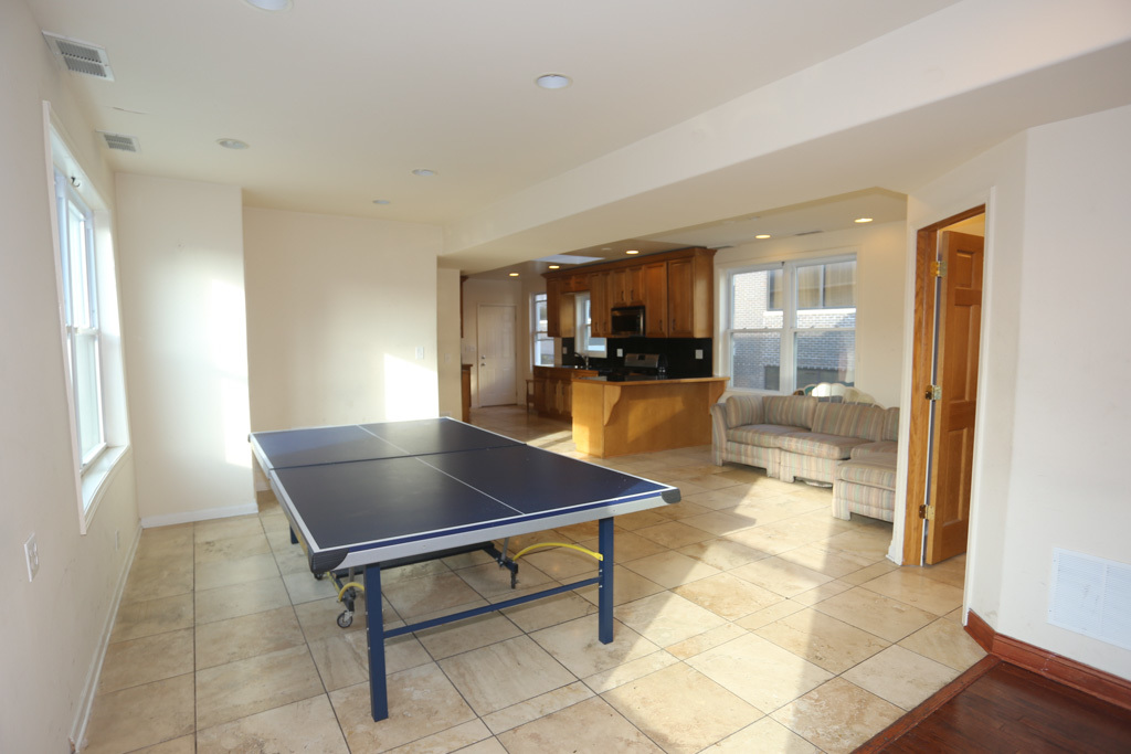 2458 North Clybourn Avenue, Unit 2F Chicago, IL 60614 - Photo 4 of 20 a room with patio furniture and a table