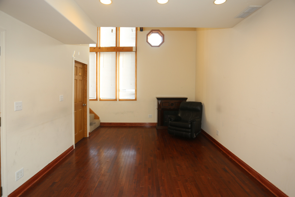 2458 North Clybourn Avenue, Unit 2F Chicago, IL 60614 - Photo 7 of 20 an empty room with wooden floor and windows