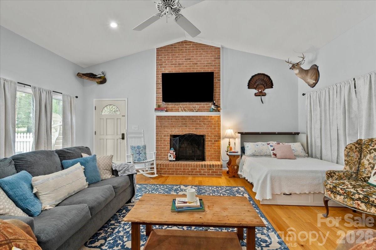 209 Fairway Road Cheraw, SC 29520 - Photo 36 of 48 a living room with furniture a flat screen tv and a fireplace