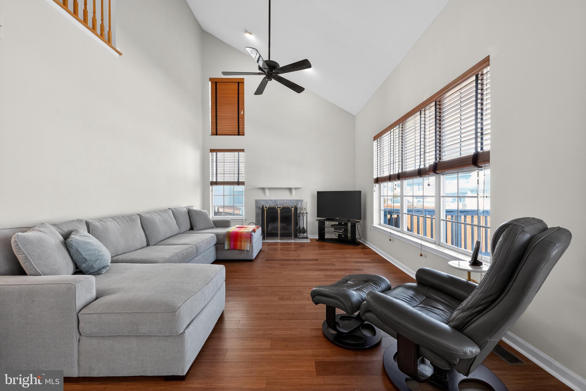 20 Colts Gait Road Marlton, NJ 08053 - Photo 14 of 36 a living room with furniture a flat screen tv and a large window