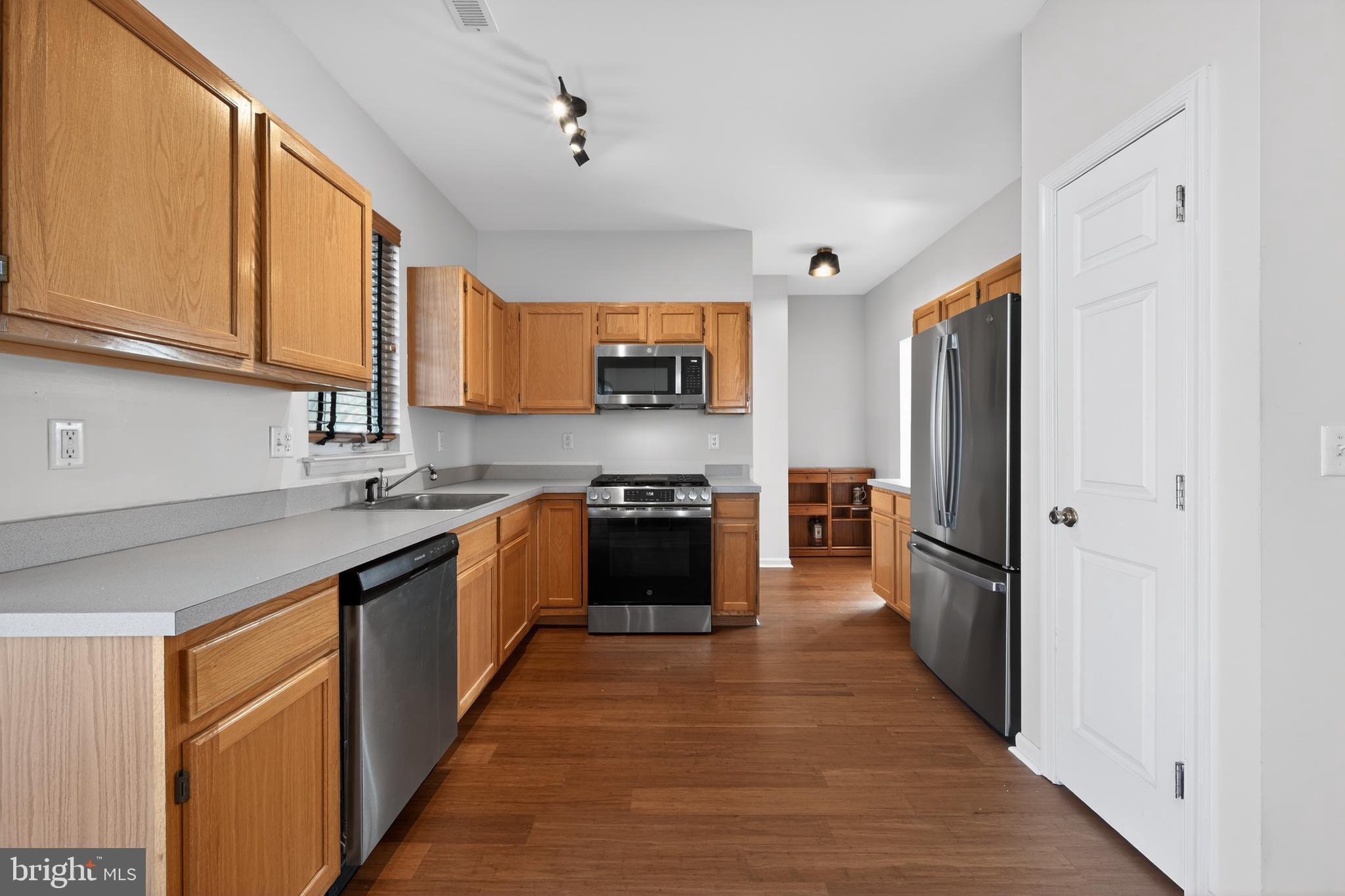 20 Colts Gait Road Marlton, NJ 08053 - Photo 7 of 36 a large kitchen with stainless steel appliances granite countertop a stove refrigerator and a sink