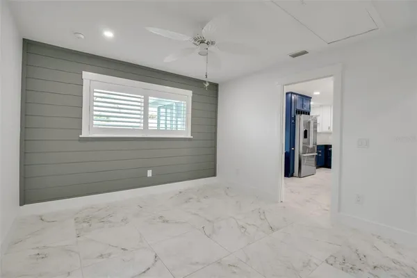 a bathroom with a toilet sink vanity and mirror