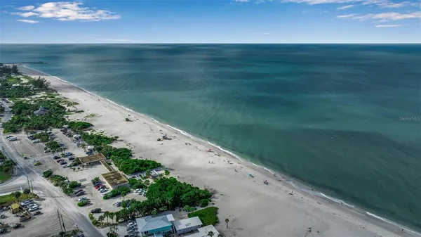 a view of a street with an ocean