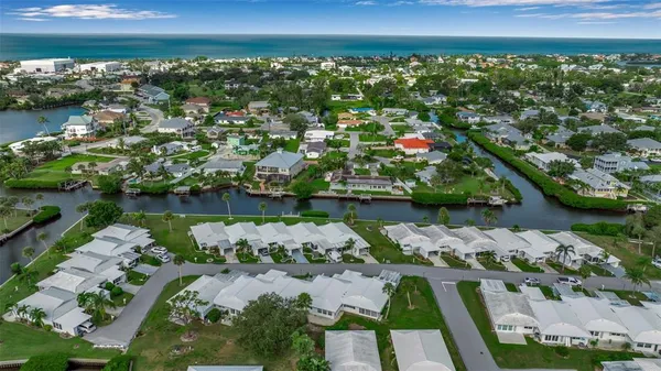 an aerial view of a house with a lake view