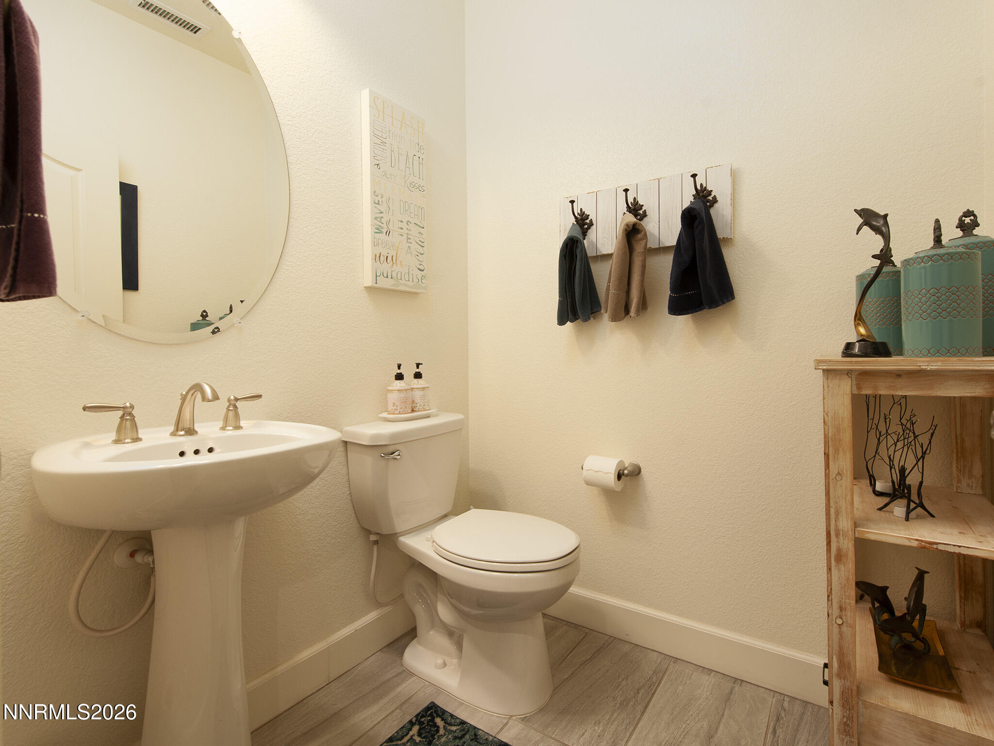 9766 Pachuca Drive Reno, NV 89521 - Photo 17 of 59 a bathroom with a sink toilet and mirror
