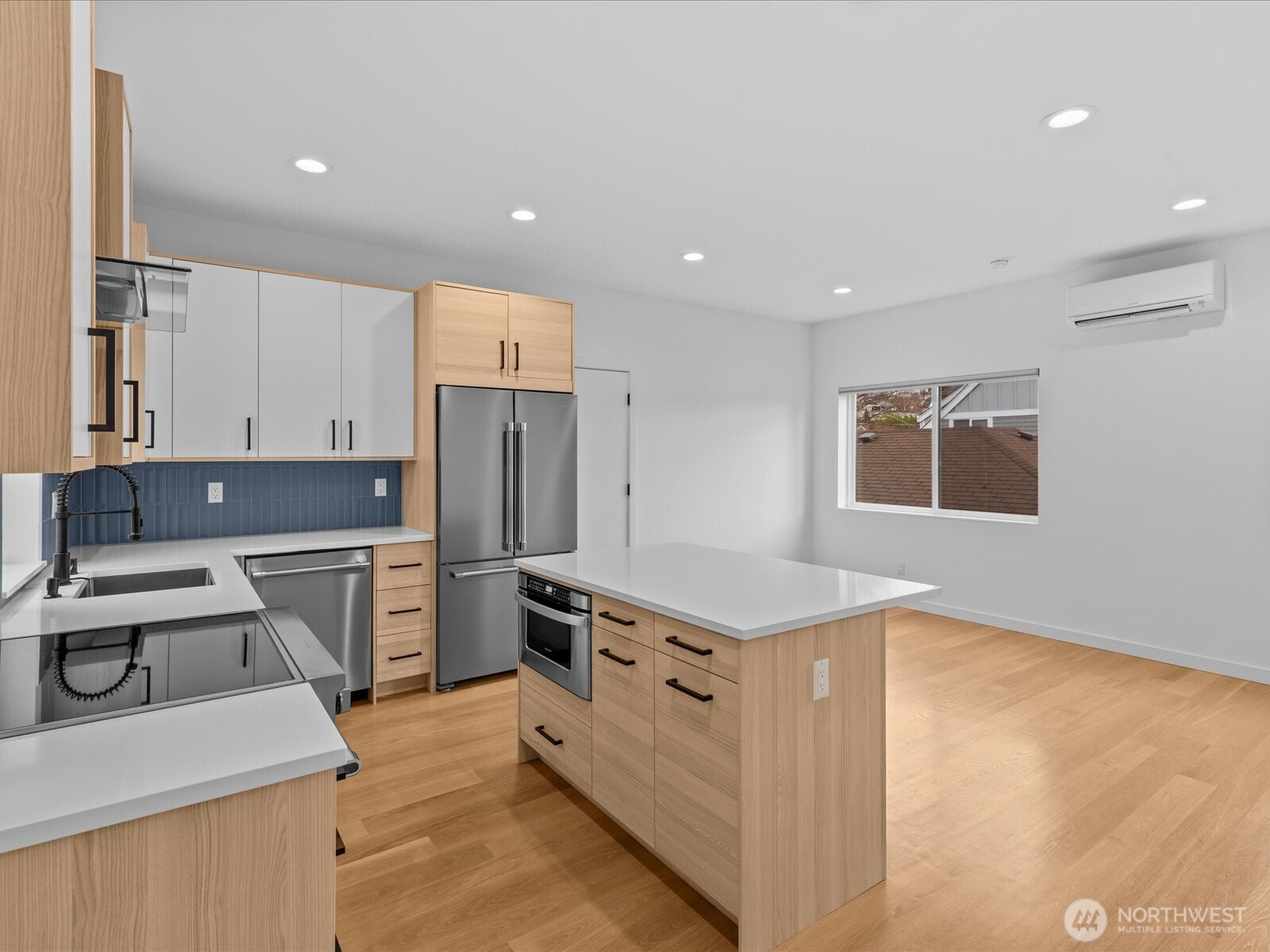 3239 61st Avenue Southwest, Unit B Seattle, WA 98116 - Photo 11 of 30 a kitchen with a sink stove and refrigerator