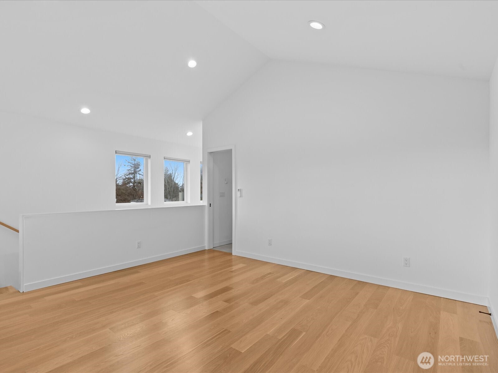 3239 61st Avenue Southwest, Unit B Seattle, WA 98116 - Photo 16 of 30 a view of empty room with wooden floor and fan