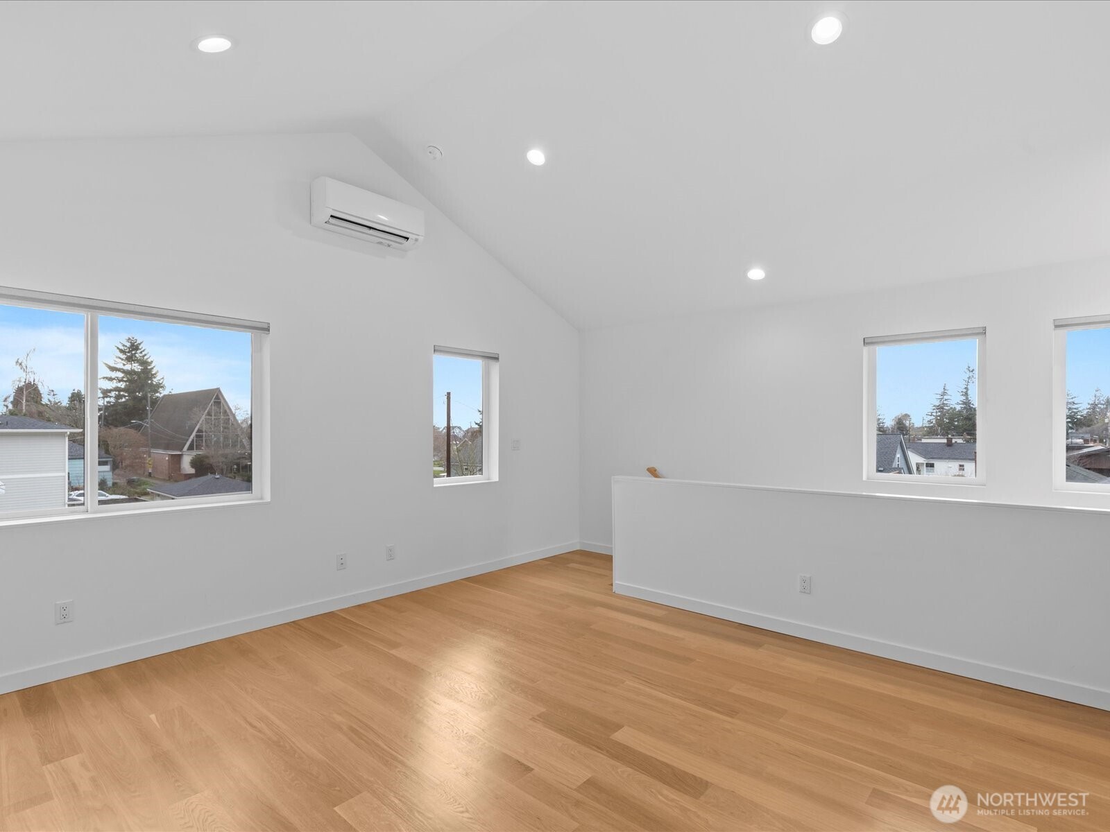 3239 61st Avenue Southwest, Unit B Seattle, WA 98116 - Photo 18 of 30 a view of empty room with wooden floor and window