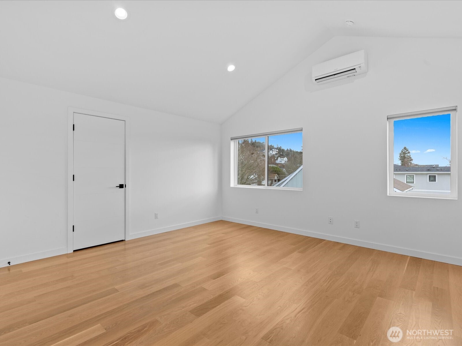 3239 61st Avenue Southwest, Unit B Seattle, WA 98116 - Photo 19 of 30 a view of an empty room with wooden floor
