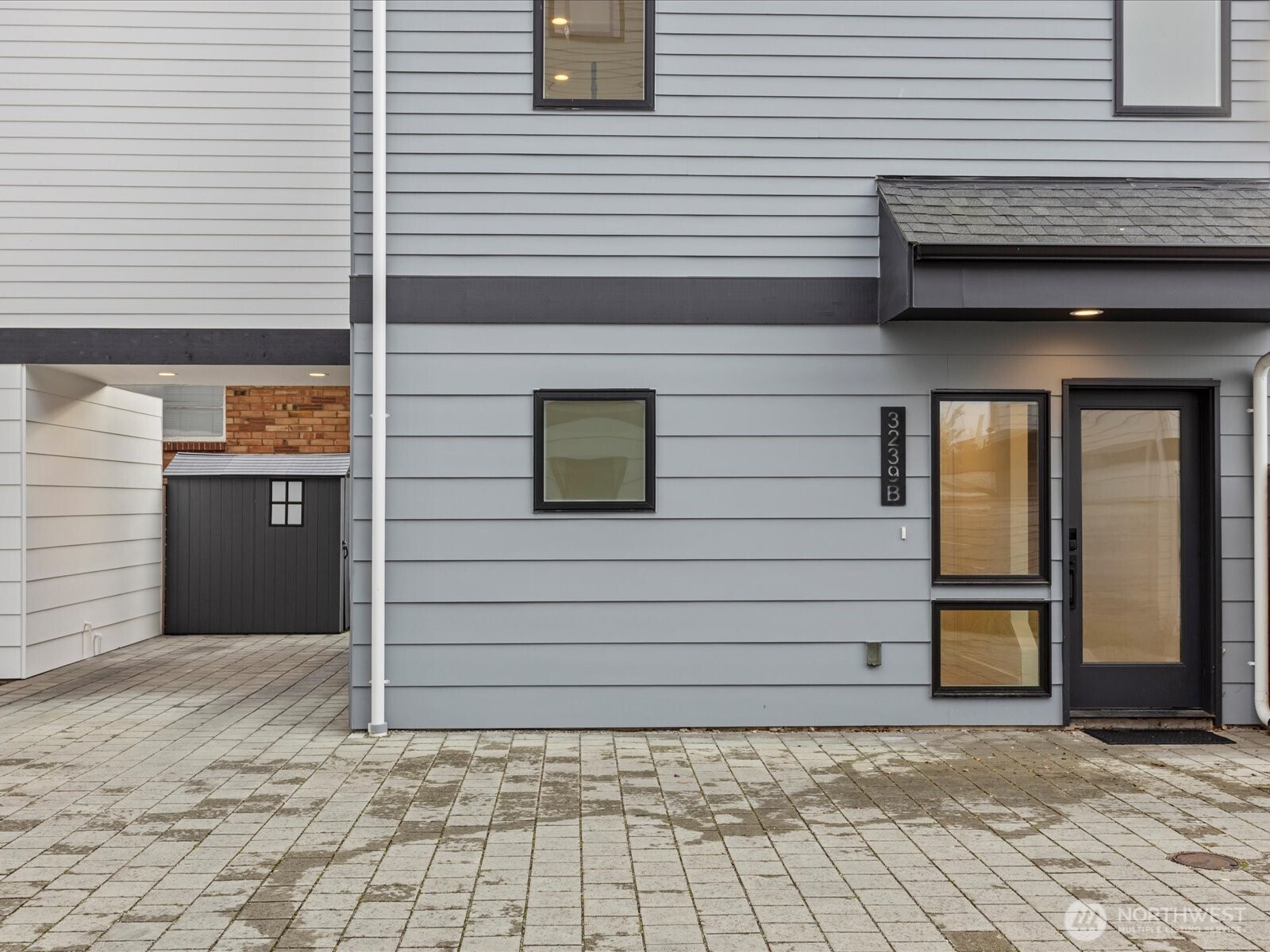 3239 61st Avenue Southwest, Unit B Seattle, WA 98116 - Photo 22 of 30 a view of a house with a door