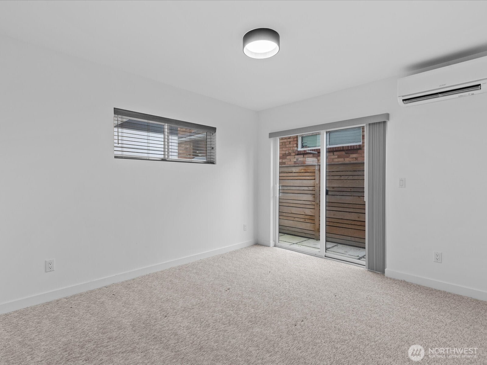 3239 61st Avenue Southwest, Unit B Seattle, WA 98116 - Photo 5 of 30 an empty room with furniture and a window