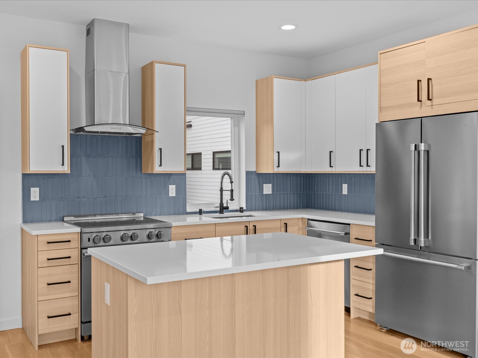 3239 61st Avenue Southwest, Unit B Seattle, WA 98116 - Photo 10 of 30 a kitchen with stainless steel appliances granite countertop a sink stove and refrigerator