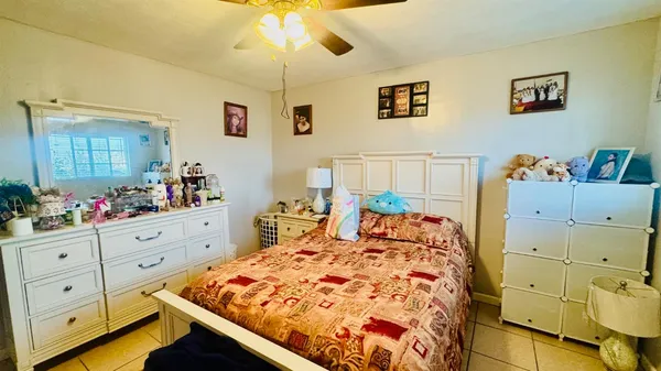 a bed room with a bed and a dresser