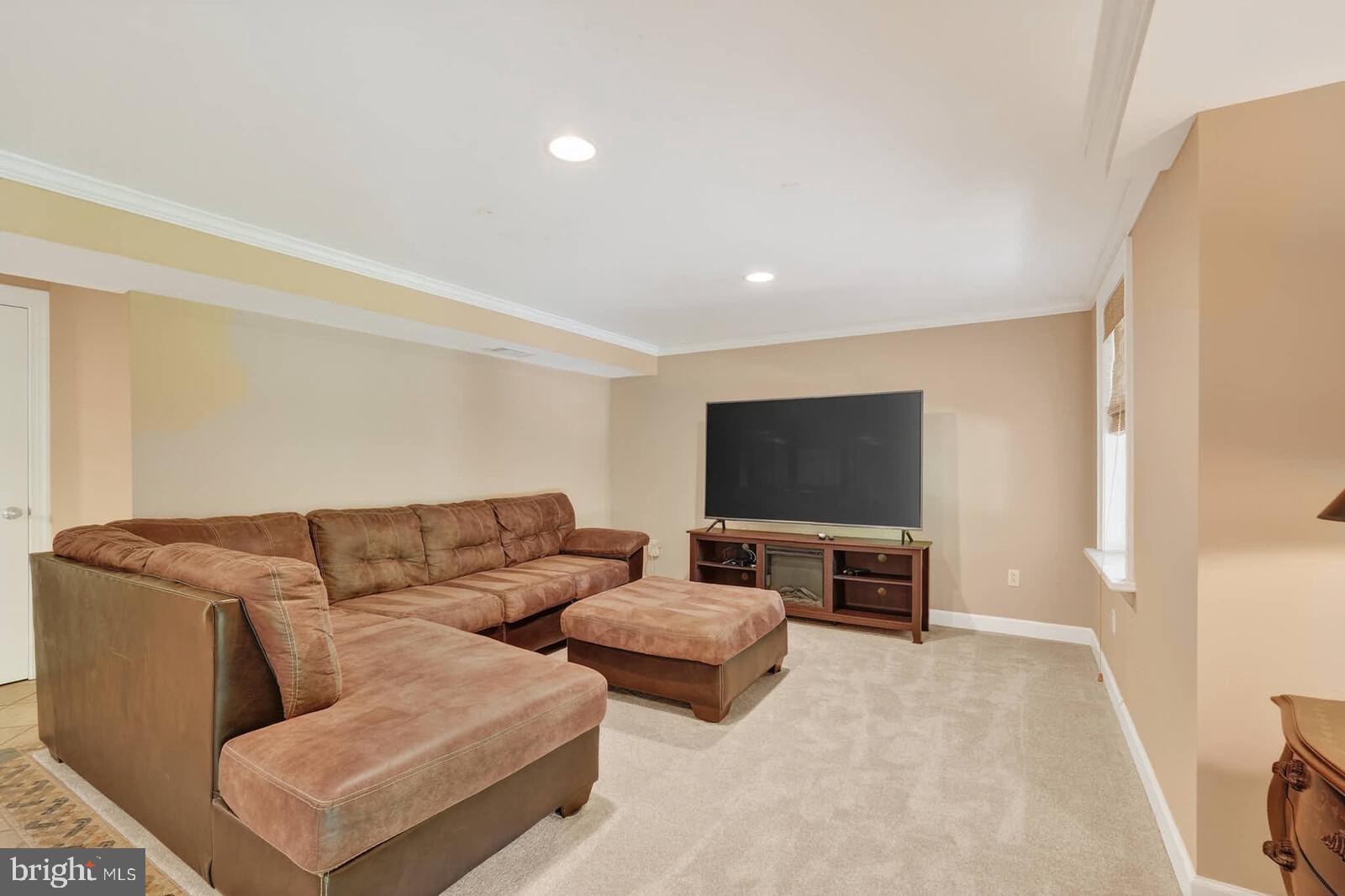 2108 Merrifields Drive Silver Spring, MD 20906 - Photo 45 of 69 a living room with furniture and a flat screen tv