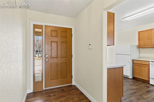 a view of kitchen and wooden floor