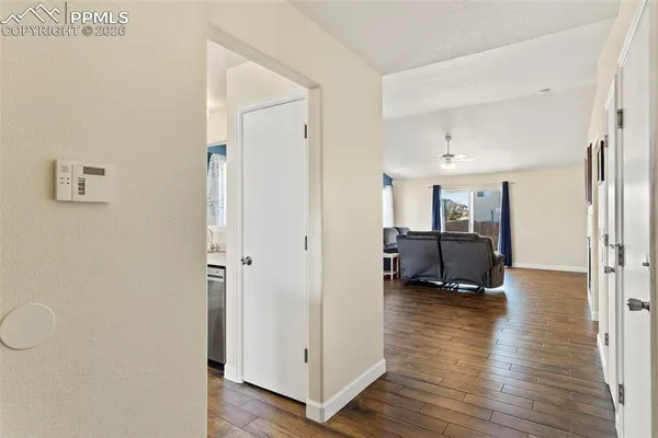 a view of living room with furniture and wooden floor