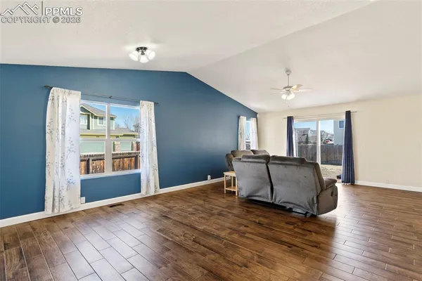 a living room with furniture and window