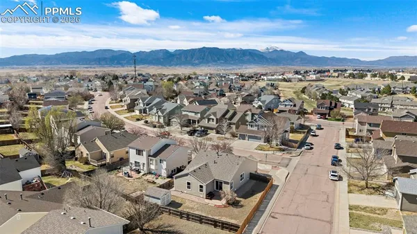 an aerial view of residential house and green space
