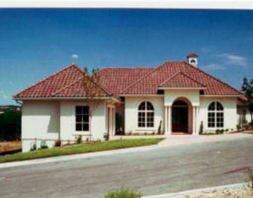 2004 Shallow Stream Cove Austin, TX 78735 - Photo 1 of 1 a front view of a house with a yard