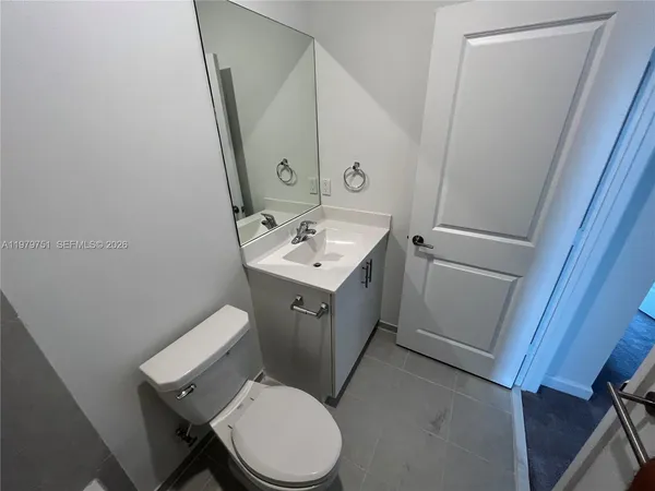 an empty room with a mirror