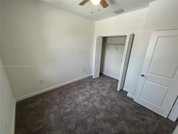 an empty room with a mirror