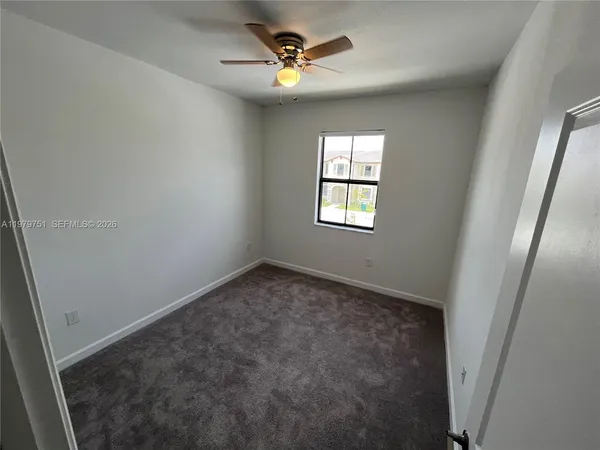 a view of a bathroom from a hallway