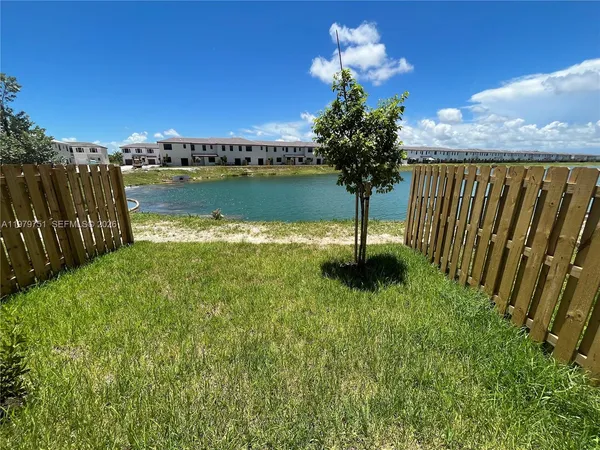 a view of a lake with a garden