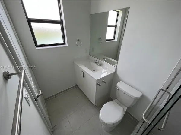 a bathroom with a shower and a toilet